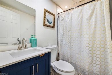Full bath featuring vanity and a shower with curtain