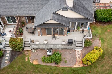 Back deck with doors from den, living room, and di