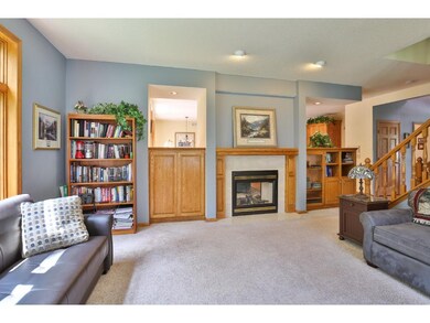 The 2-sided fireplace is framed by built-in storag