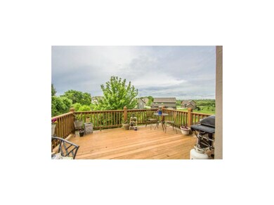 Deck Overlooking Fenced Yard with Mature Trees