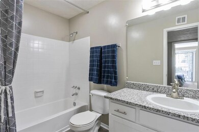 Full bathroom featuring vanity, shower / tub combo