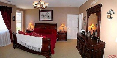 Master bedroom with two walk-in closets.