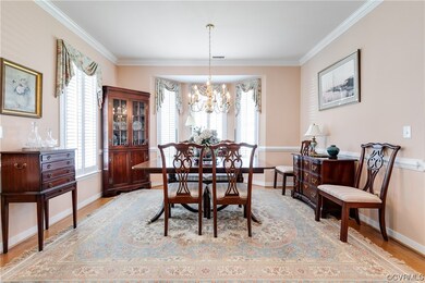 Dining Room with Bay Window, Chair Rail, and Crown