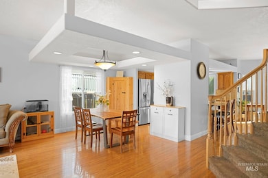 Dining area featuring stairs, light wood-type flooring