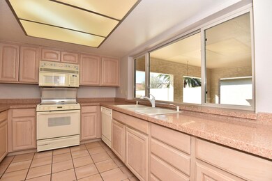 Kitchen looking out to covered patio.