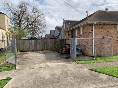 Rear access to property with gated parking.