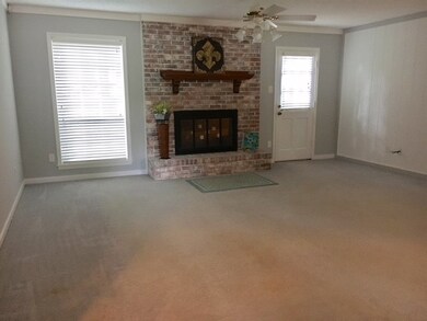 The focal point is the pretty fireplace and door l