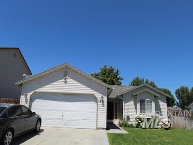 Ranch-style house with concrete driveway and an attached garage