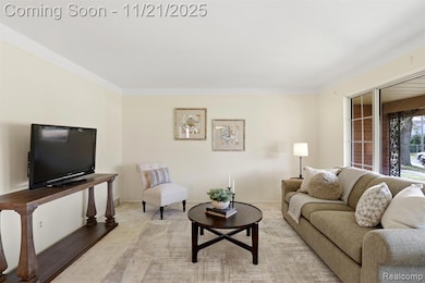 Carpeted living area with baseboards