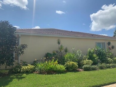 LUSH LANDSCAPING WITH CEMENT TILE ROOF CBS BLOCK C