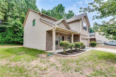 Brick Front House Featuring Front Covered Porch, Garage, Level Drive Way