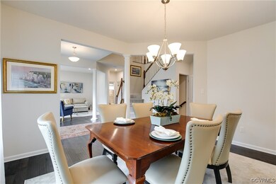 Dining area featuring ornate columns, an inviting