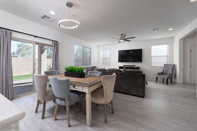 Dining space featuring light wood-style flooring, recessed lighting, and ceiling fan
