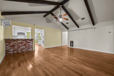 Living room adjoins the kitchen with a cute breakfast bar