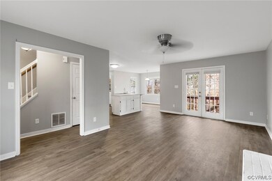 VIEW OF FAMILY ROOM OPENING UP INTO THE KITCHEN AN