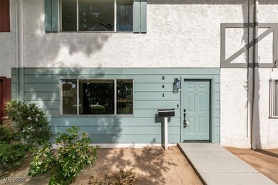 Doorway to property featuring stucco siding
