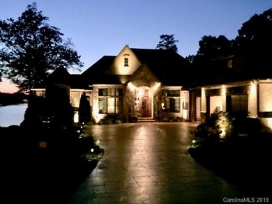 Stunning home has lovely courtyard to greet your g