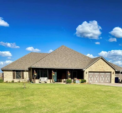 View of front of property with a front lawn and a 