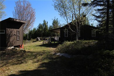 View of cabin from driveway. ...