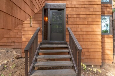 Enclosed front entry with storm door provides anot