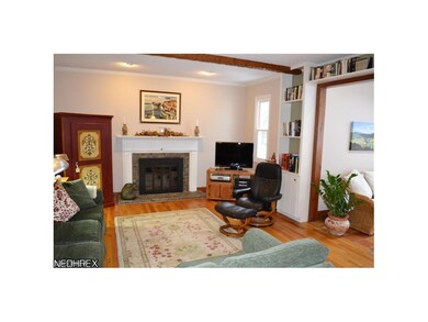 Family room with wood burning fireplace with gas l