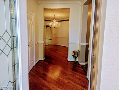 Corridor featuring a notable chandelier, ornamenta