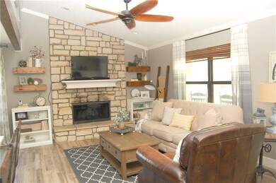 Custom stone wood burning fireplace and vaulted ce