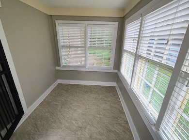 Unfurnished sunroom featuring plenty of natural light