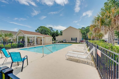 Community pool with a patio area