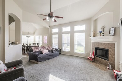 Cozy family area, wood burning fireplace.