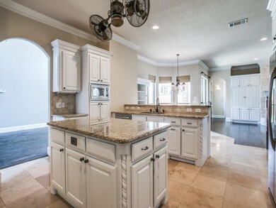 Gorgeous kitchen with custom cabinets painted whit