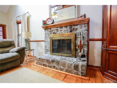 Beautiful wood burning stone fireplace in the livi