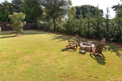 Fenced yard with trees added for additional privacy