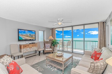 Tiled living room featuring a textured ceiling, expansive windows, plenty of natural light, and a ceiling fan
