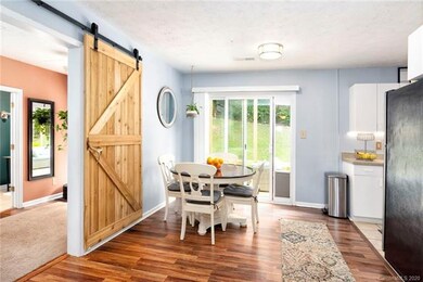 Custom barn door slider closes off the main bedroom wing from the rest of the house. Homestay potential?