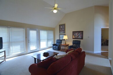 Great room has plenty of natural light with row of
