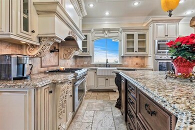 Kitchen with Thermador appliances gas range and wa