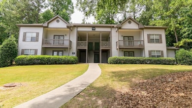 View of front of home with a balcony and a front l