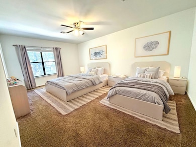 Bedroom featuring carpet floors and ceiling fan