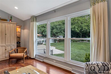 Bright and inviting Living Room offers great views of the backyard.