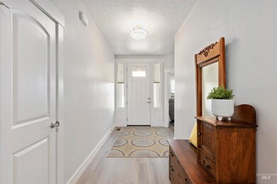 Entryway featuring light wood finished floors and baseboards