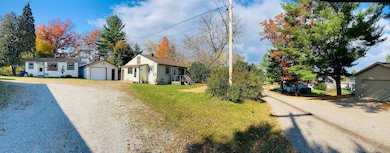 201 Gasoline Aly, Houghton Lake, MI 48629 - photo 2