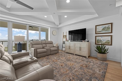 Living room featuring ceiling fan, decorative coff