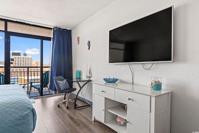 Bedroom with access to exterior, dark hardwood / w