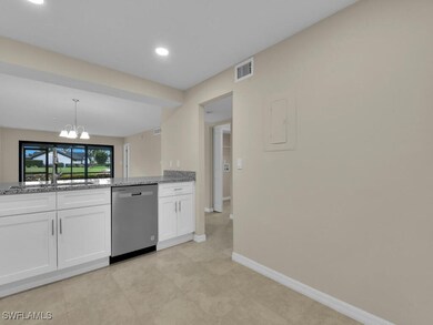 Kitchen featuring visible vents, light stone count