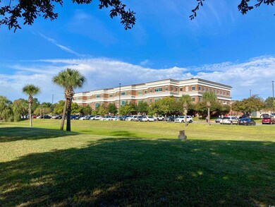 View of community featuring a lawn