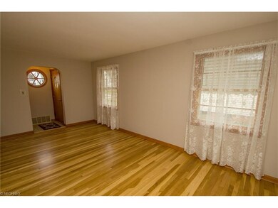 Spacious living room with gorgeous refinished hardwood floors