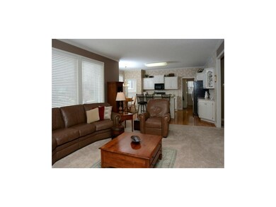 Great Room with a fireplace and open floor plan.