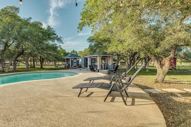 Swimming pool with a patio, an outbuilding, a yar
