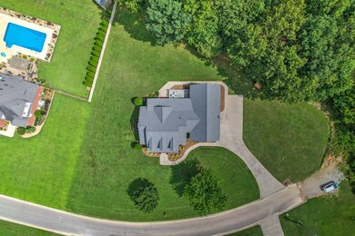 Backs up to nearly 60 acres of woods